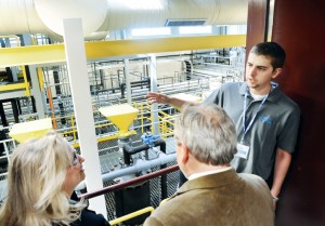 Brendon Stout shows Linda Green and Fred Shanks the Process Devloping Unit, (PDU) during a tour at SENTEC . The machines perform reaction and purifying processes, which is part of the process to convert biomass to cellulosic sugars. photo Steven Mantilla, Work It, SoVa